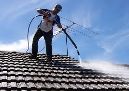 man using pressure washing 