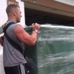 man lifting furniture